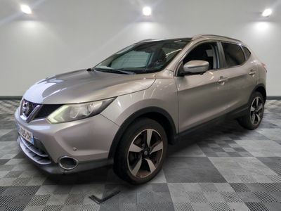 the silver nissan suv is parked on a checkered tile floor
