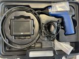 a tool in the case that is sitting on the table