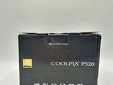 a close up of a box of a camera on a white surface