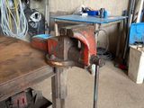 a table that has a machine on it in a garage