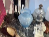 a table with a book, spoons, and other items on it