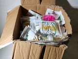 a cardboard box with a bunch of items inside of it