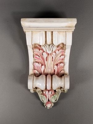 a close up of a decorative object on a gray wall