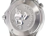 a close up of a watch with a lion on the face