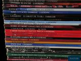 a lot of books stacked on top of each other