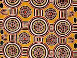 a yellow and black rug with circles and dots on it