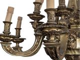a chandelier that has five candles on it