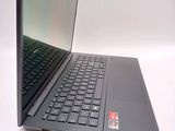 a laptop computer that is sitting on a white surface