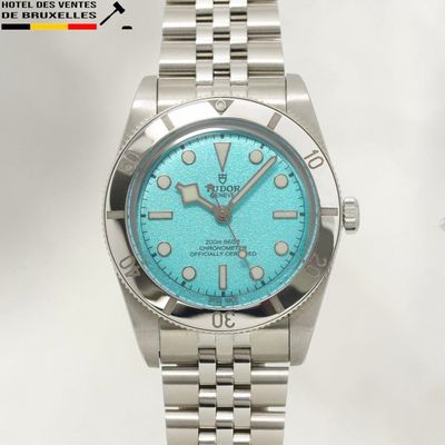 a watch that has a blue dial on it
