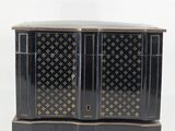 an image of a black and gold chest of drawers on a white background