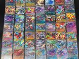 a bunch of pokemon cards sitting on top of a table
