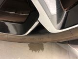 a close up of a car tire with a hole in it