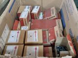 a cardboard box filled with boxes of different types of items