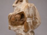 an image of a sculpture of a man with a hat on his head