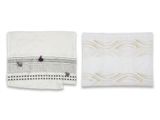 a white towel and a black and white towel on a white background