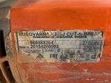 a close up of a rusted orange motor with a sticker on it