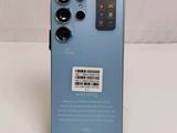 a close up of the back of a blue phone with a barcode on it