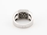 a white gold ring with black and white diamonds