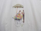 embroidered picture of a man selling flowers in a cart on a white shirt