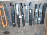 a lot of different types of blades on the floor