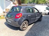 a small car that is parked in the parking lot