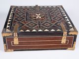 a wooden box with a decorative design on it