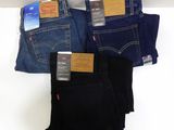 three pairs of levi ' s jeans are stacked on top of each other