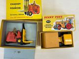 a box of dinky toys with a fork and a fork in it