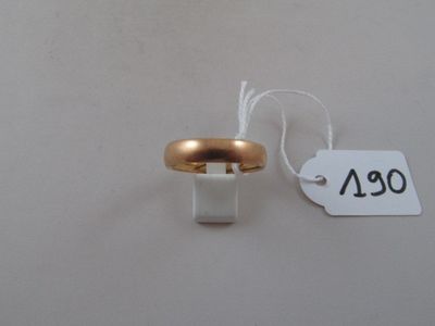 a gold ring with a price tag attached to it