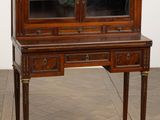 an image of a wooden desk with a glass door on top