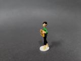 a small figurine of a man holding a box