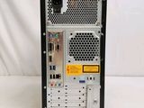 the back view of a computer with a keyboard and mouse on it