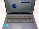 an open laptop computer sitting on top of a white table