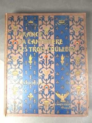 un livre bleu et rose orné d'un motif doré