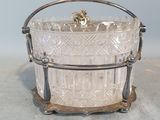 an image of a glass ice bucket with a handle on a table
