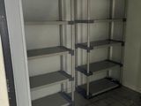 a room with shelves and a tiled floor in it