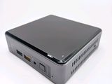 an image of a small computer sitting on top of a white surface
