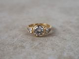 a close up of a diamond ring on a table