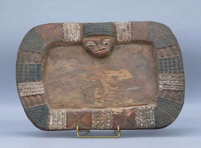 an image of a decorative plate with a face on it