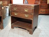 two wooden drawers with brass handles on each of them