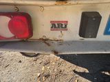 two red and white lights on the back of a truck
