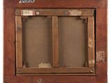 an old picture of a window with a wooden frame and a sticker on it