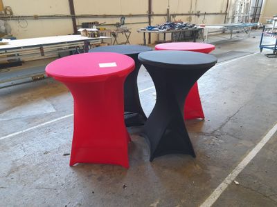 two tables that have red and black tables on them
