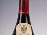 bottle of red wine with a gold label on a white background