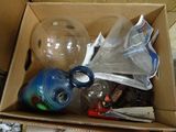 a cardboard box filled with assorted items on the floor