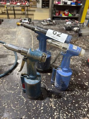 two air tools that are sitting on a table