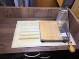 a cutting board and a knife on a cutting board