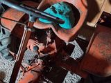 an old tractor with a blue glove on the seat
