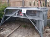 a metal bench with a sign on it in the yard