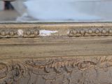 a close up of a gold box with carvings on it